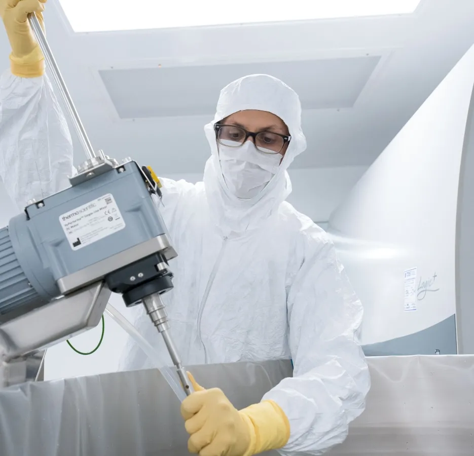 Scientist adjusting lab equipment